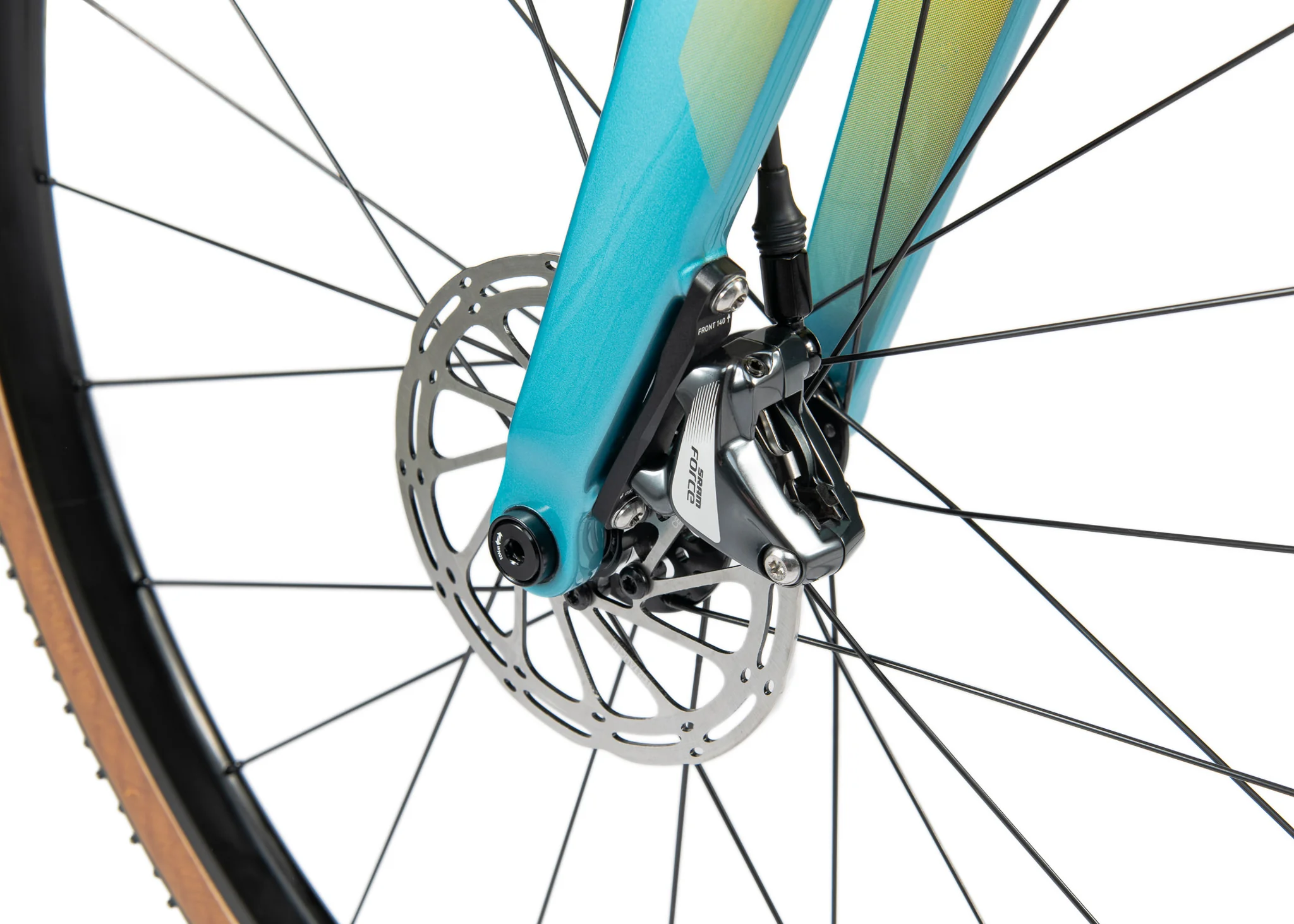 Front disc brake and teal carbon fork of a Bombtrack Hook EXT C.