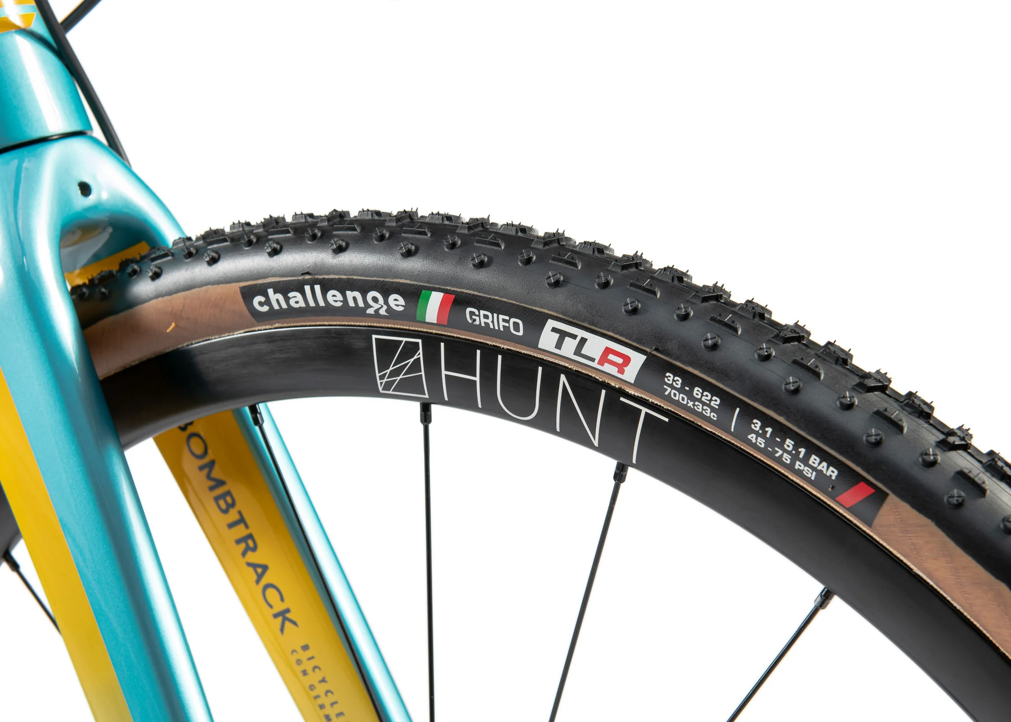 Macro shot of a knobby Challenge Grifo tire on a Hunt carbon wheel.