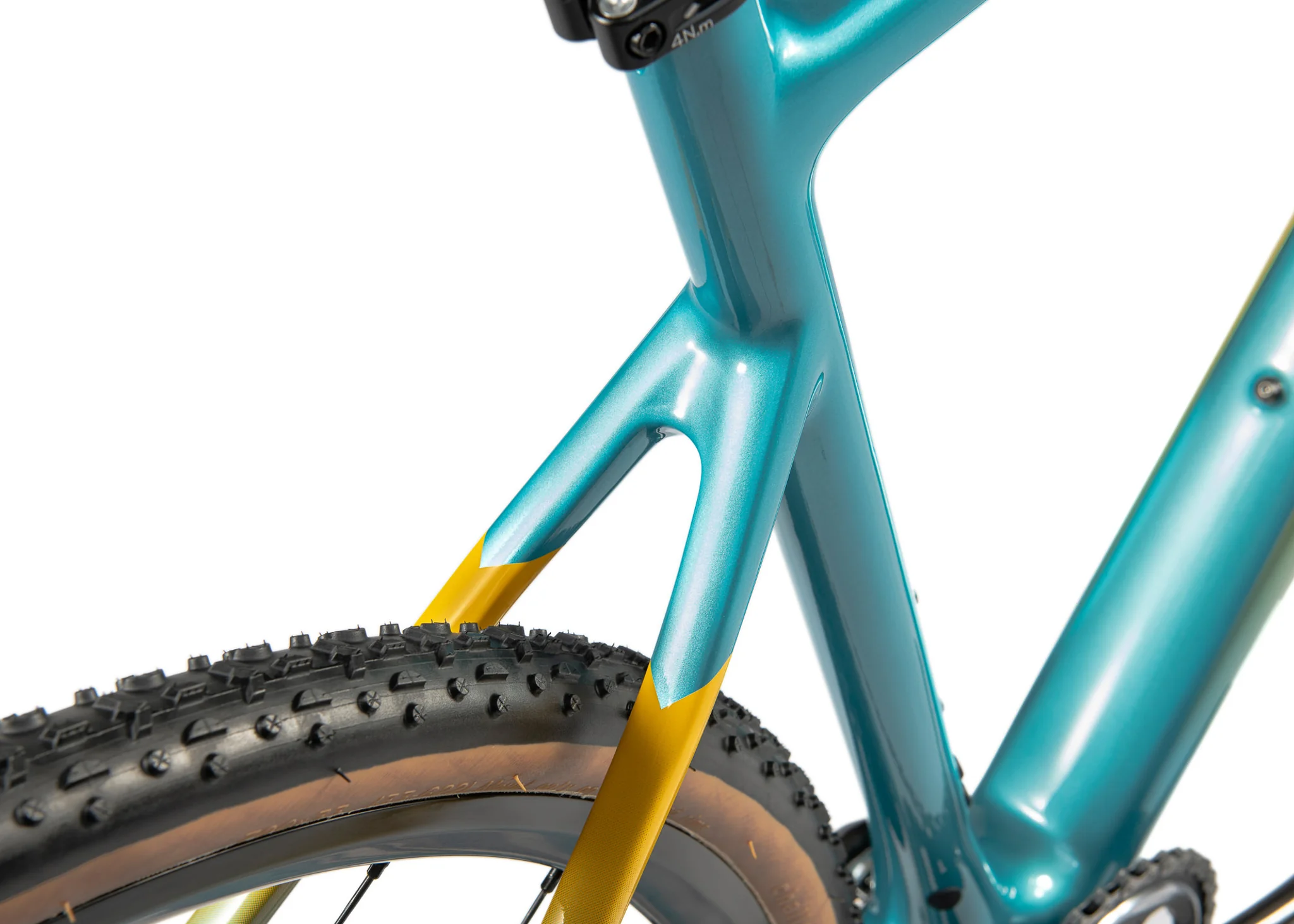 Detail of the seat stay junction on a teal carbon Bombtrack frame.